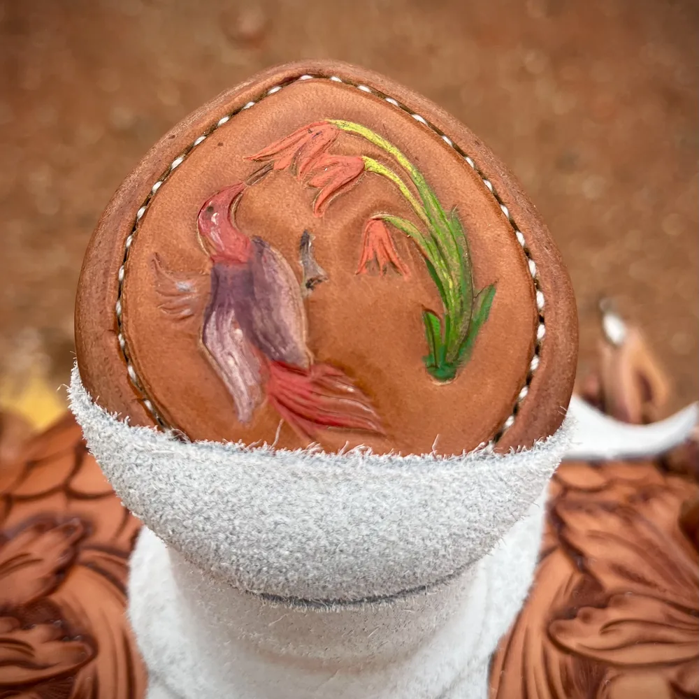 Saddle horn cap with color-tinted hand carving